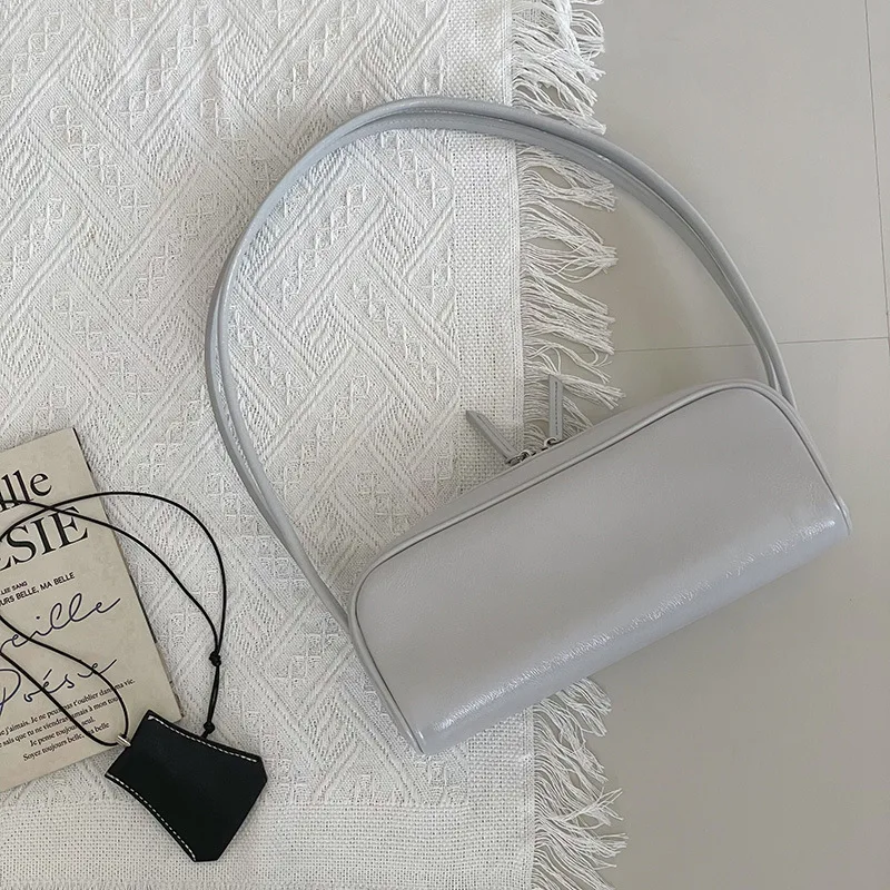 Echt lederen onderarmtas 2025, nieuwe niche-ontwerp, oliewas, koeienhuid, vintage handtas, mode, high-end damesschoudertas