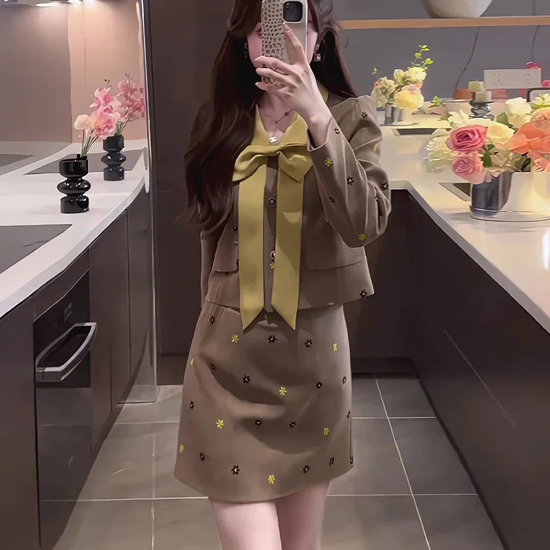 French temperament, high-end feel, contrasting color bow long sleeved top, 2024 spring/autumn high waisted skirt two-piece set