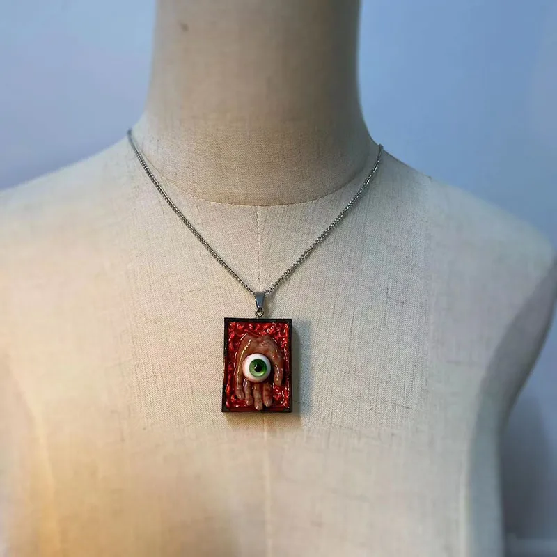 

Handmade sweater chain, niche handmade necklace, eye ball palm pendant