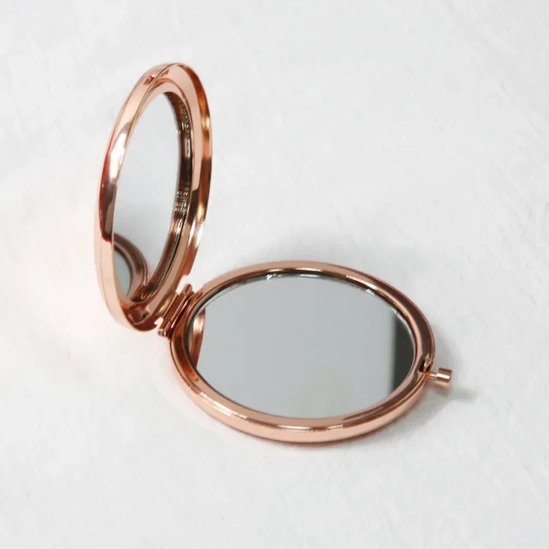 Miroir de poche rond double face en métal, mini miroir de maquillage pliant, tenu dans la main, cadeaux cosmétiques, sac à main de voyage