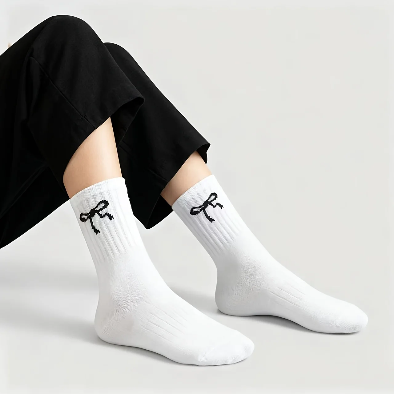 4 pairs of comfortable mid length sports socks for women, featuring a striped design for breathability and warmth, perfect for