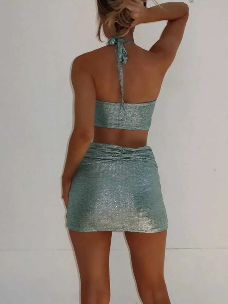 BKQU Halter Sexy Hollow Out Bodycon Mini Jurk Vrouwen Lace-Up Backless Glanzende Dames Strand Vakantie Party Korte Jurk 2025, Zomer