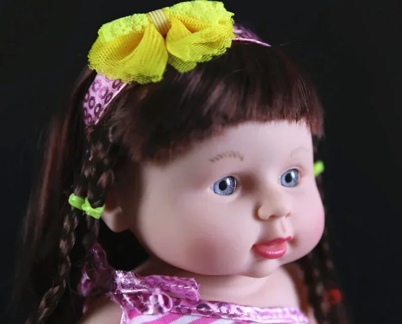 Muñeca Reborn con diadema y lazo de ojos azules para niña, muñeco recién nacido de 30cm, regalo, novedad