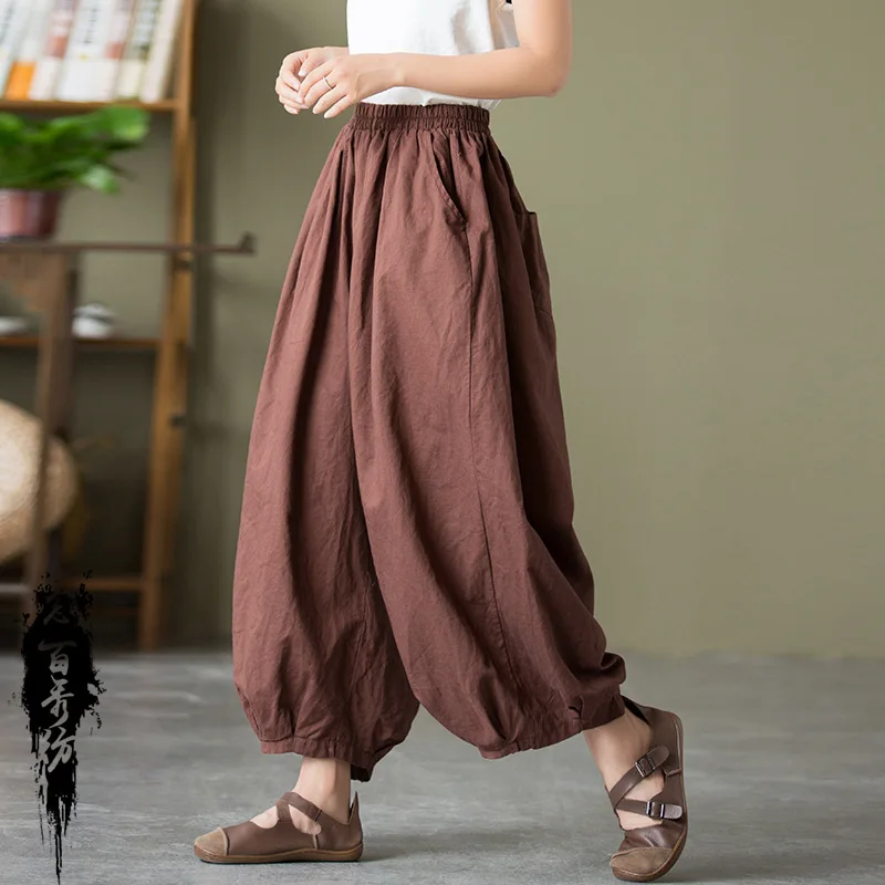 A/W stone-washed linen harem pants with an elastic waist and cropped ankle length for a relaxed fit.