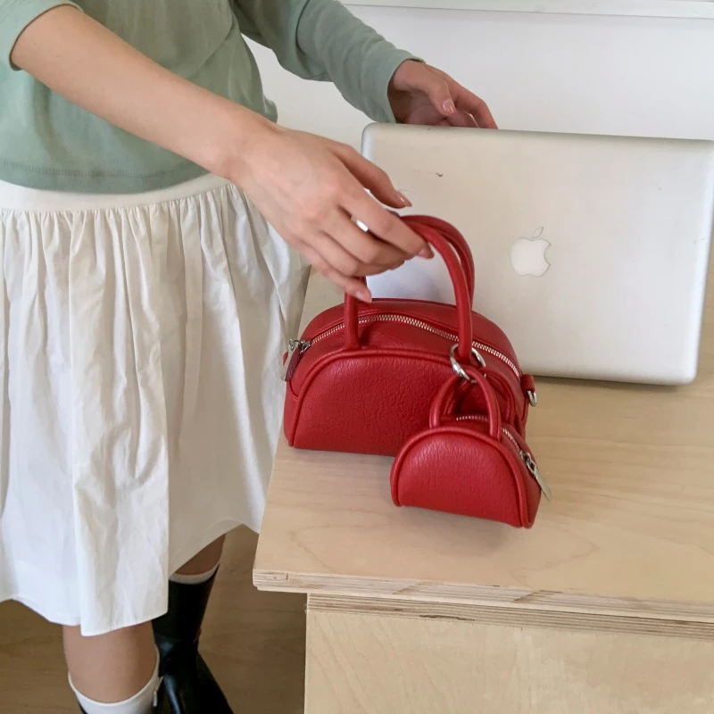 

Korean cute girl hand-held bowling bag 2025 new fashion trend shell bag niche simple exquisite mother-child bag