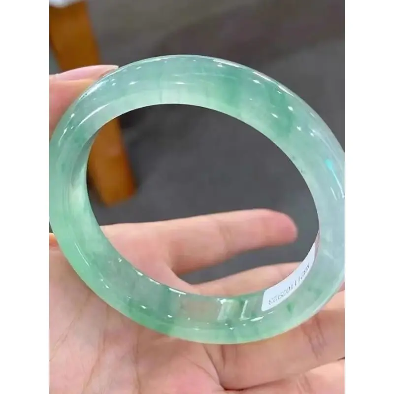 Myanmar ice jadeite bracelet with green inclusions, high translucency, clear water color, regular round shape, wide version, wom