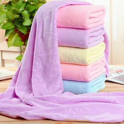 A pair of embossed bear thickened soft absorbent bath towels and beach towels
