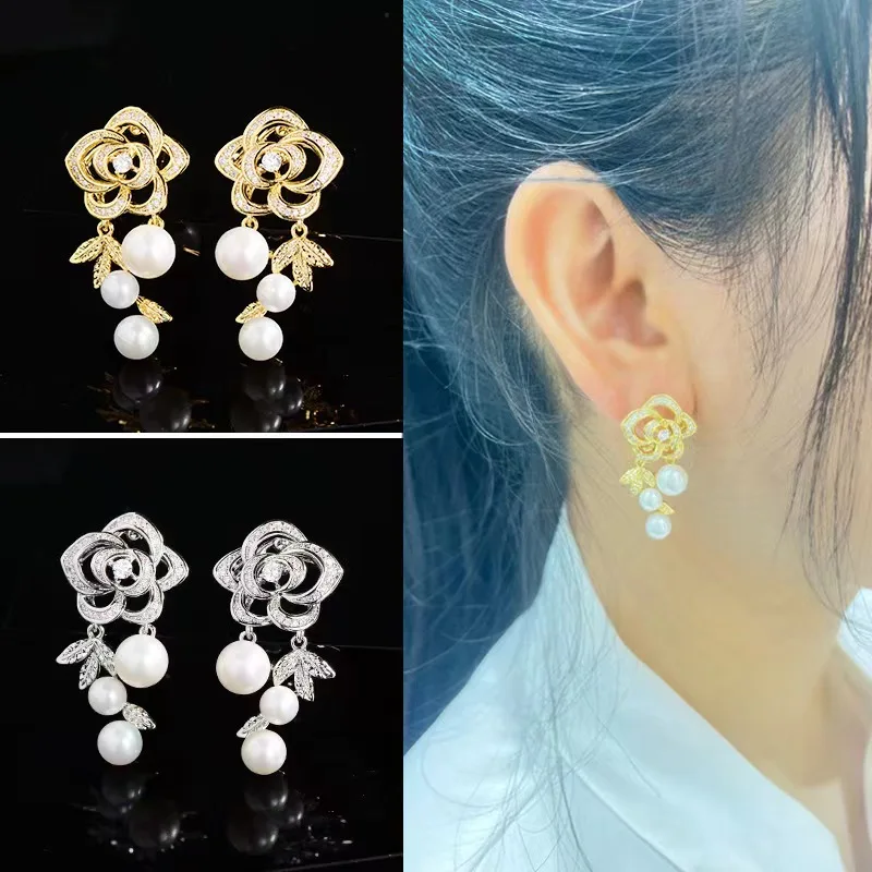 

Camellia pearl earrings Fashion design sense imitation earrings female light luxury earrings high sense niche earrings