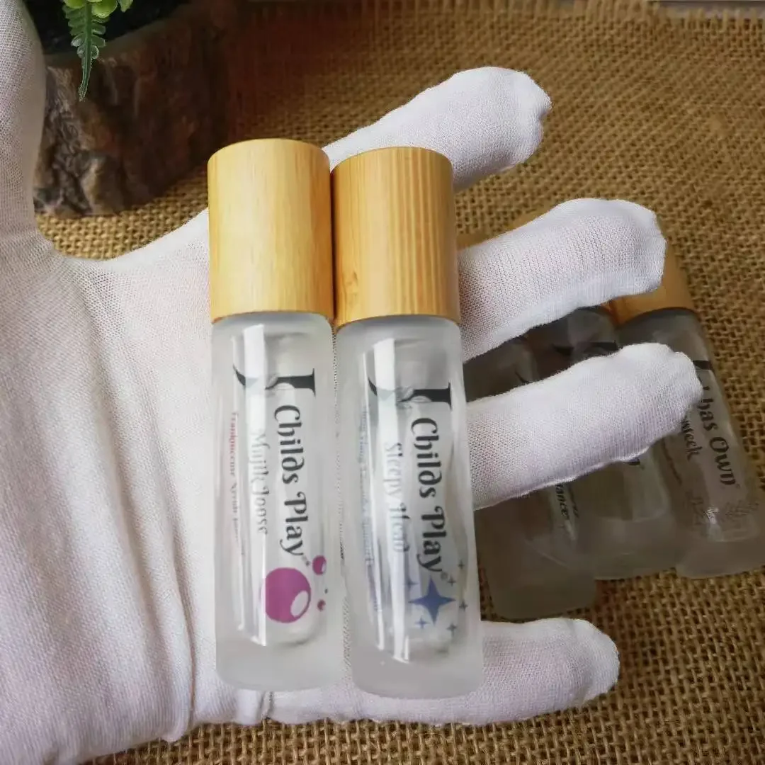 

Natural bamboo lids cosmetic packaging attar container clear roll on glass bottle perfume bottle Refillable BottleWithRollerBall