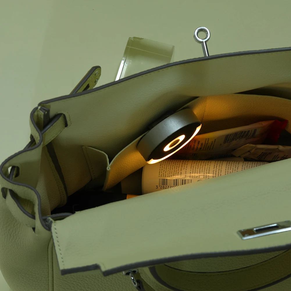 Luce per borsa con sensore automatico Illumina la luce rotonda della borsa con clip posteriore Luci per borsa con controllo touch per accessori per borse