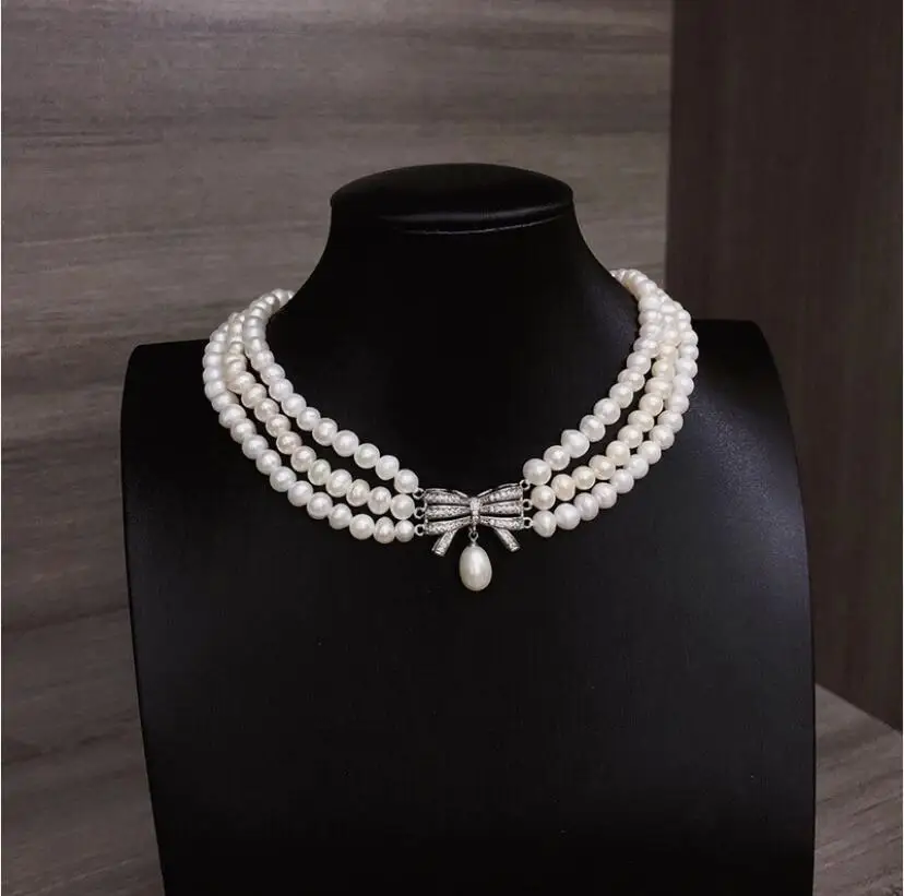 

Ожерелье из трех нитей белого жемчуга Южных морей диаметром 5-6 мм, 16–17 дюймов.