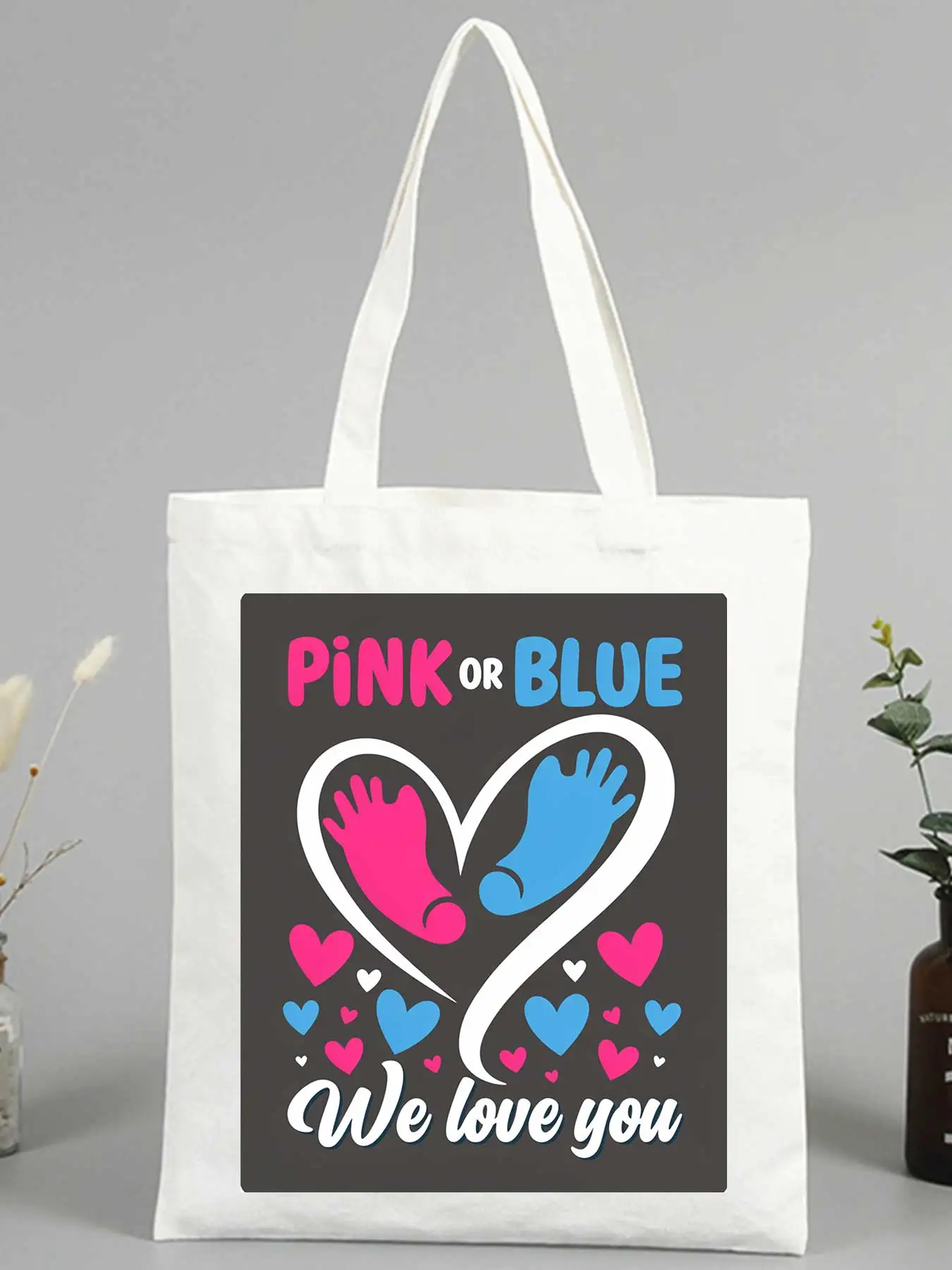 Parents' canvas tote bag with heart and footprint graphic, ideal for baby shower and casual outings