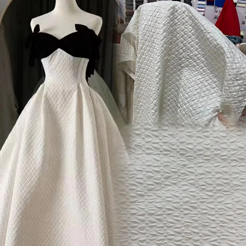 

This white jacquard relief satin fabric is a three-dimensional creative retro plaid jacket, skirt, DIY bag, designer fabric
