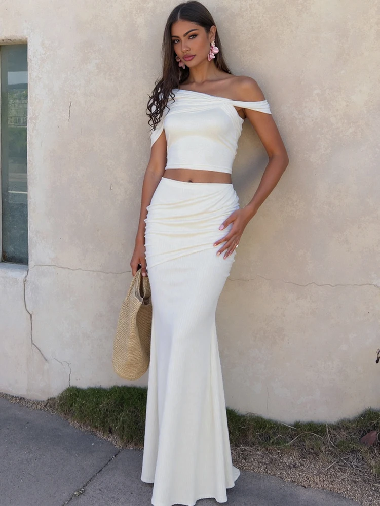 Kliou 非対称エレガントな 2 点セット女性固体シンプルな傾斜ショルダースリム Tシャツ + プリーツマキシスカート女性のハイストリートスーツ