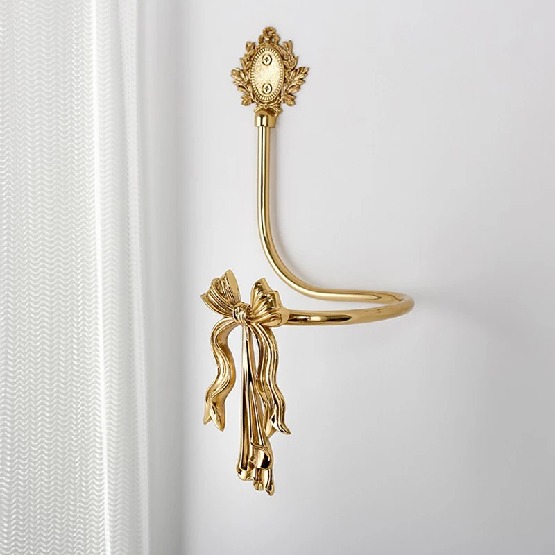 

Retro brass bow curtain hook creative American light luxury European living room bedroom decoration wall hanging wall hook