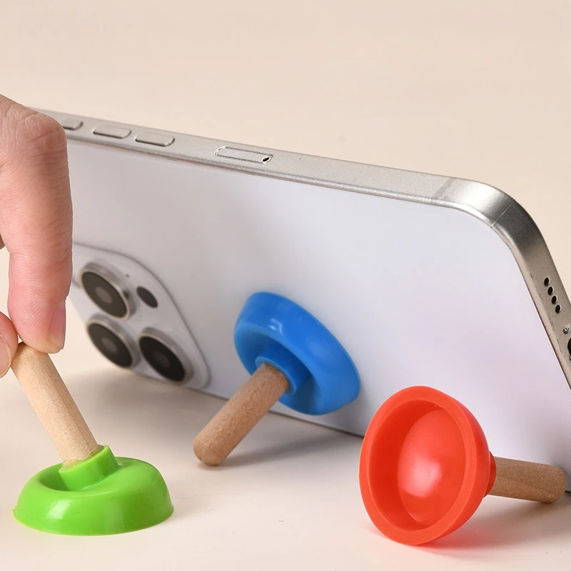 

A Multifunctional Silicone Toilet Plunger Phone Holder with a Suction Cup, Perfect As a Quirky Gift Or Toy