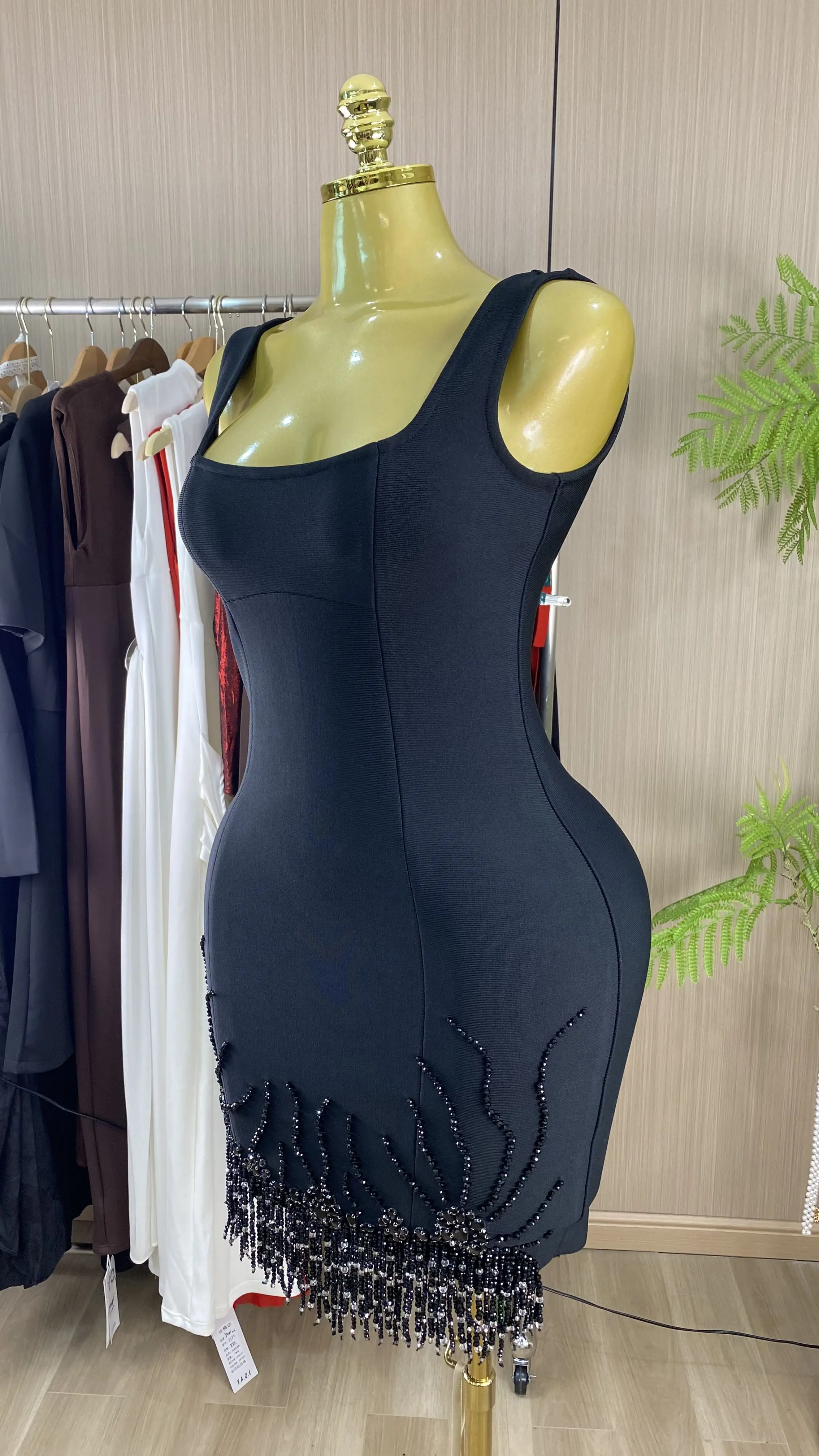 Elegant, form-fitting mini dress with a strapless bodice, rhinestone-embellished straps, and fringe detailing.-GZXX984