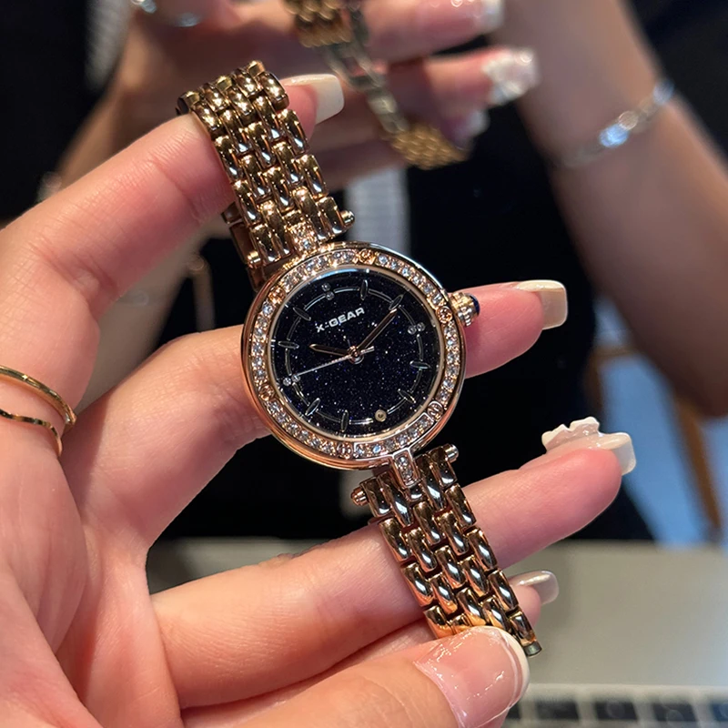 ساعة كوارتز نسائية أنيقة بمينا مرصعة بالنجوم من X-GEAR - ساعة عصرية بسوار من الفولاذ المقاوم للصدأ هدية للمهرجانات