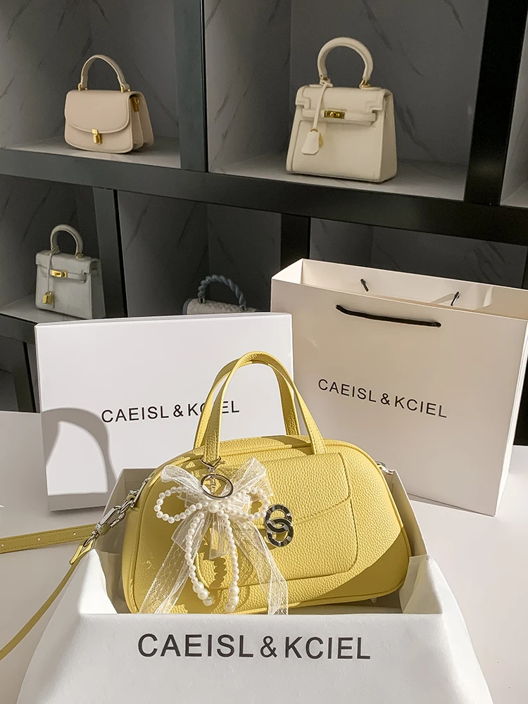 

Cute and Luxury Pillow Bag with Charming Decoration Simple and Pendant Women's Stylish and Versatile Handheld Crossbody Bag