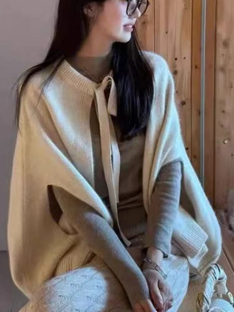 Scialle maglione coreano elegante tinta unita da donna dolce fiocco legato cardigan lavorato a maglia senza maniche moda maglieria esterna allentata