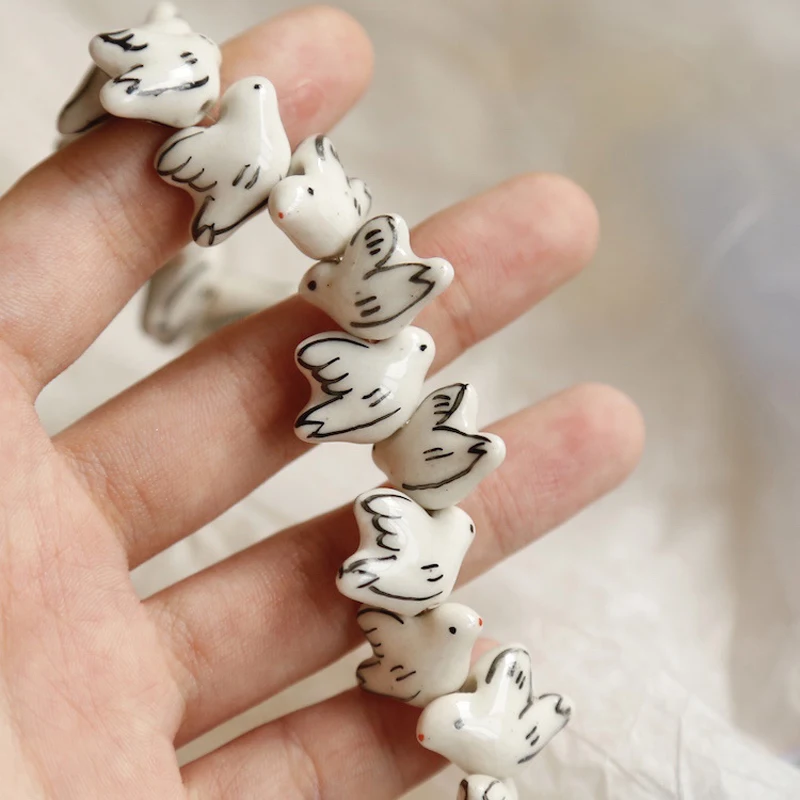 10 sztuk ręcznie malowane białe Dove ceramiczne koraliki 18x1 2mm koraliki dystansowe luzem gołąb ptak porcelany koralik do tworzenia biżuterii DIY akcesoria