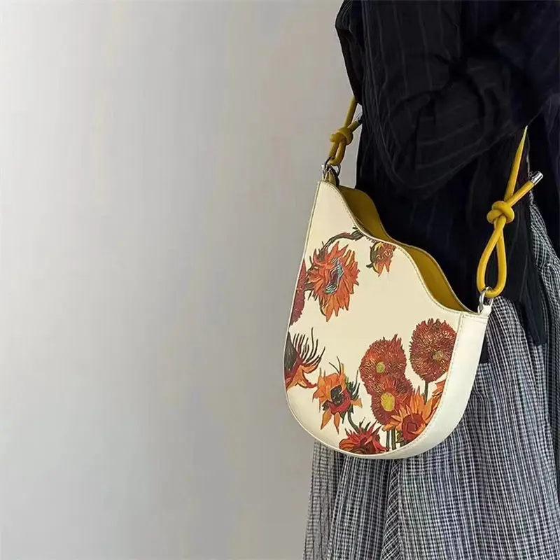 2025 new fashion women's leather leather retro sunflower seed rope knot and color paint series handheld armpit crossbody bag