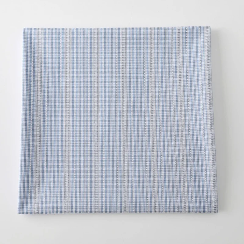 

Sea salt color cotton-polyester fabric with blue and white checkered striped pattern. Shirt. Skirt. Handmade garment surface.