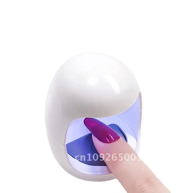 Mini LED Nail Art Light Egg Draagbare handlamp met één vinger voor sneldrogende en lichttherapie Roze/wit niet-zwart handmodel