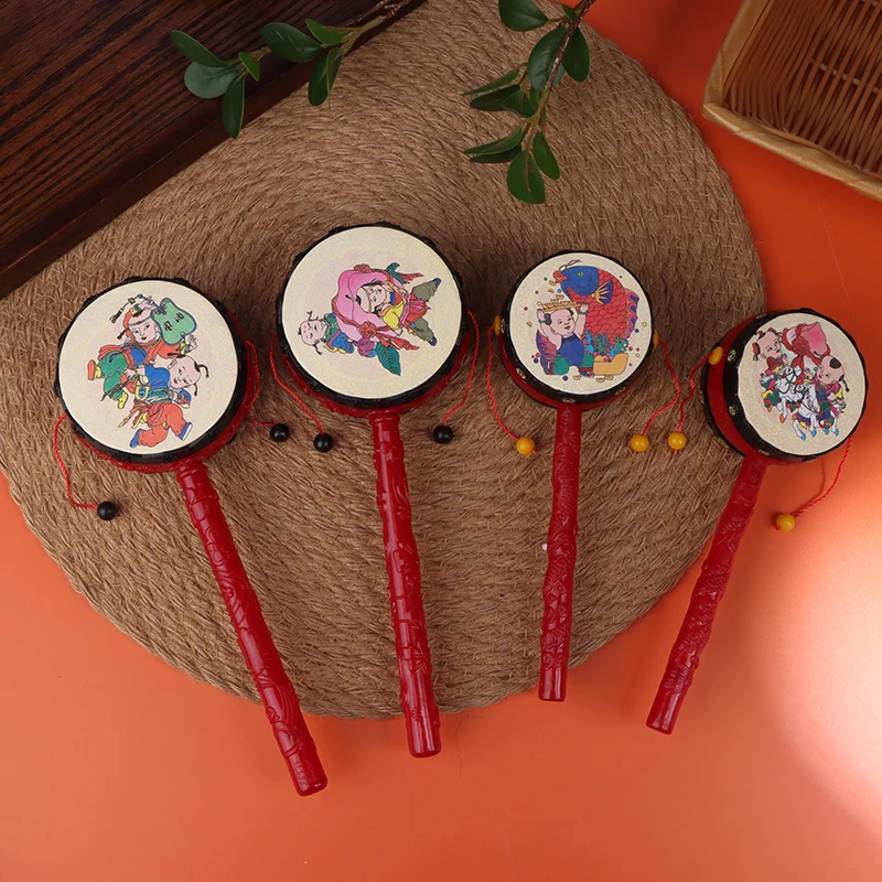 1PC Cartoon Chinese Tambourine Traditional Style Rattle Drum Spin Toys Hand Bell Plastic Beginners Musical Instrument Toy Random