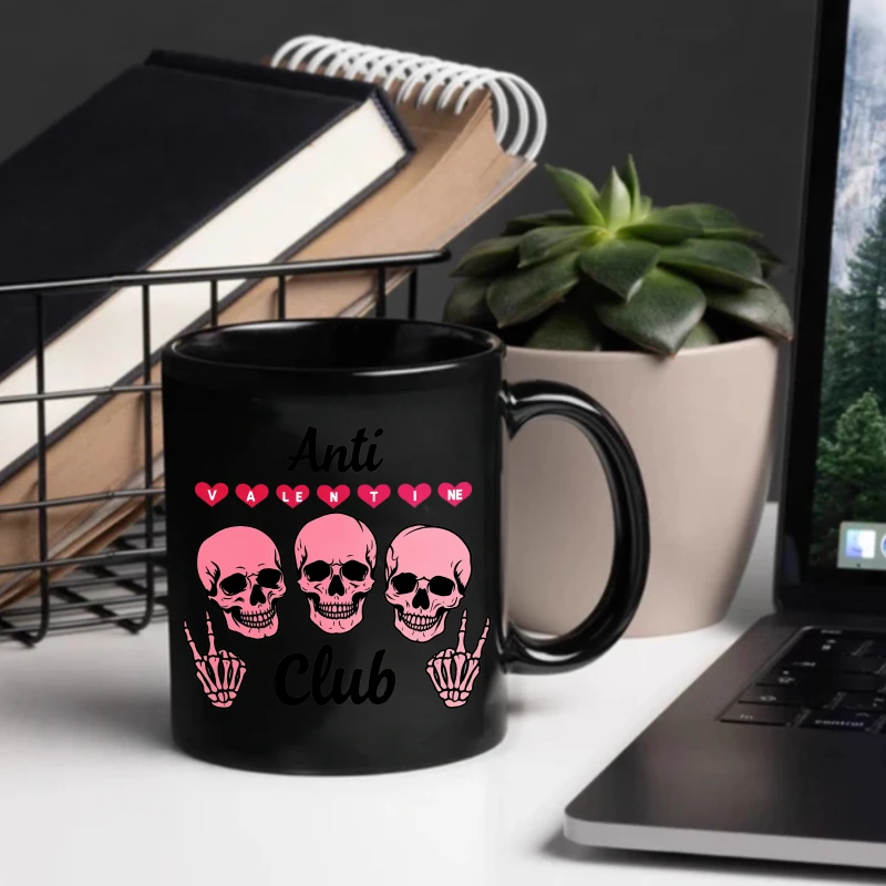 Anti-Valentine's Club black mug with pink skull and heart design, suitable as an anti-Valentine's Day gift