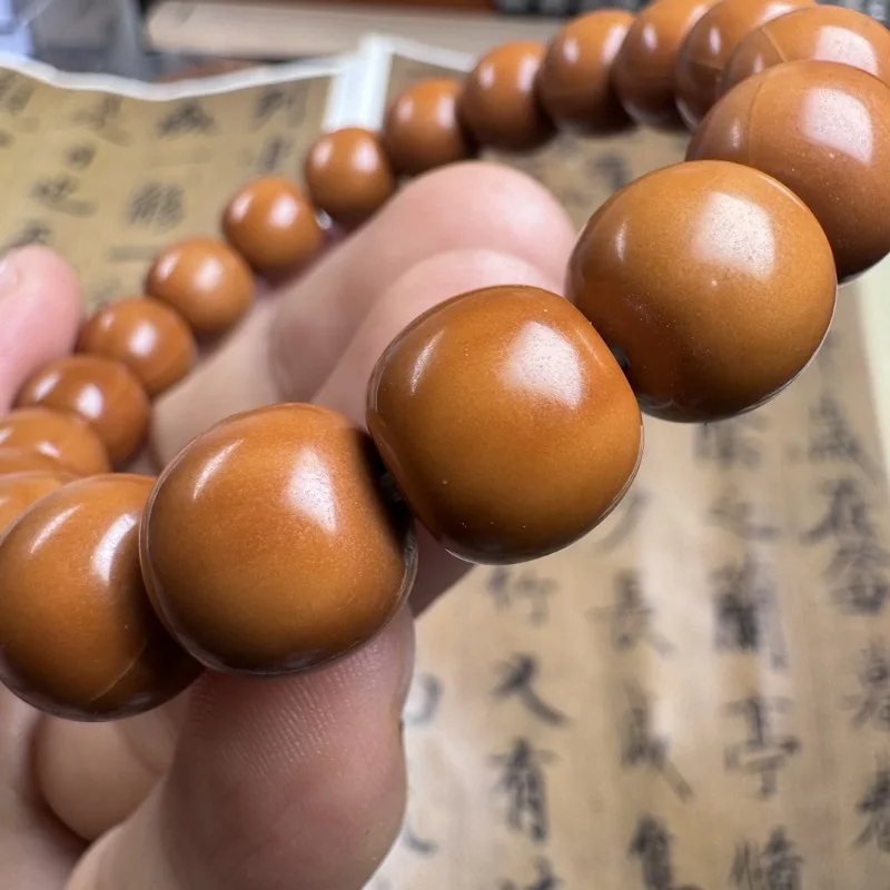 B-grade black background, old- carved monkey head walnut bracele, Beijing-style eight-sided peach-shaped beads magic bead