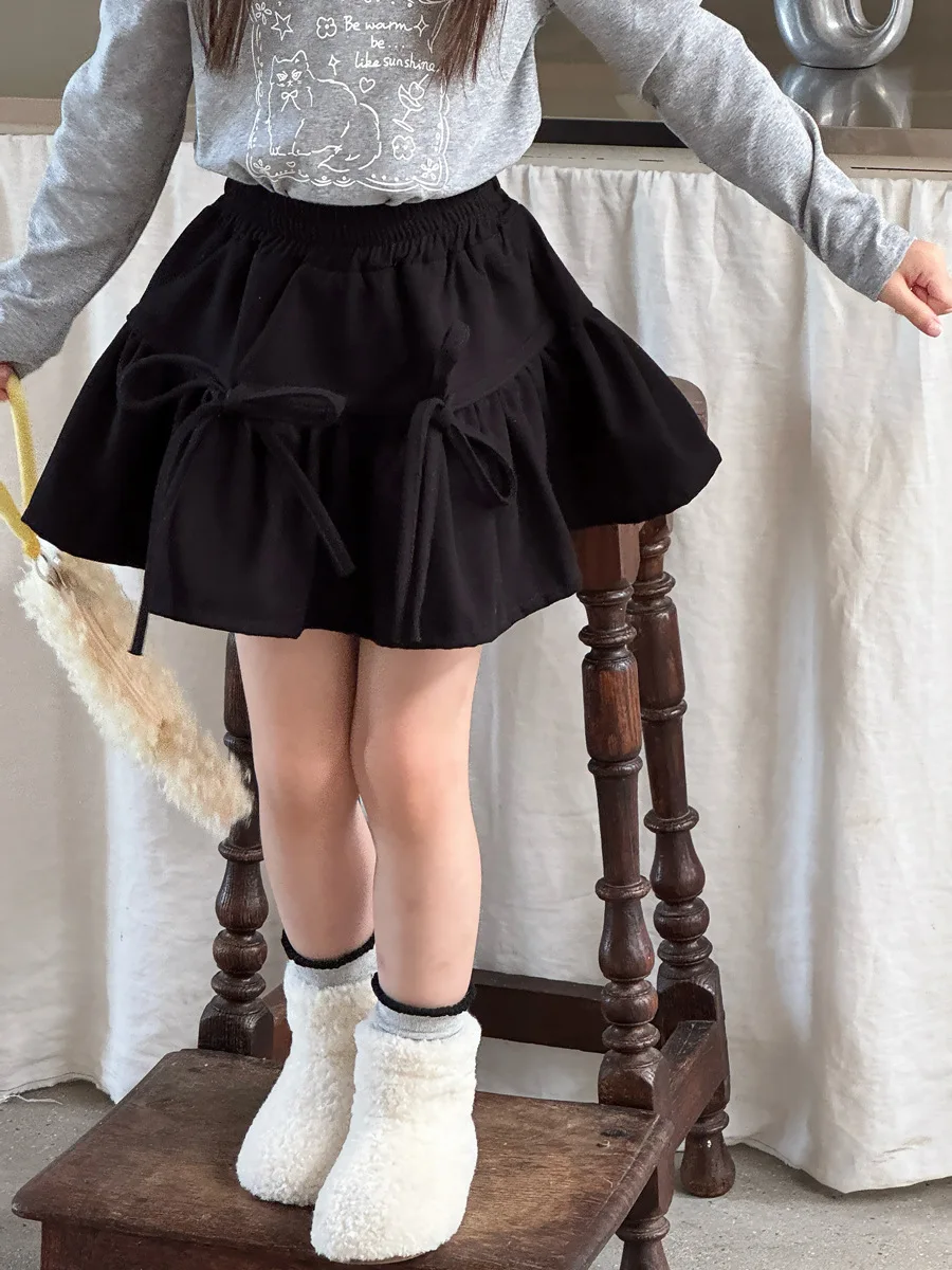 الفتيات الخريف والشتاء النسخة الكورية الجديدة من مرحة القوس حزام تنورة صوفية كلمة تنورة قصيرة أزياء عارضة