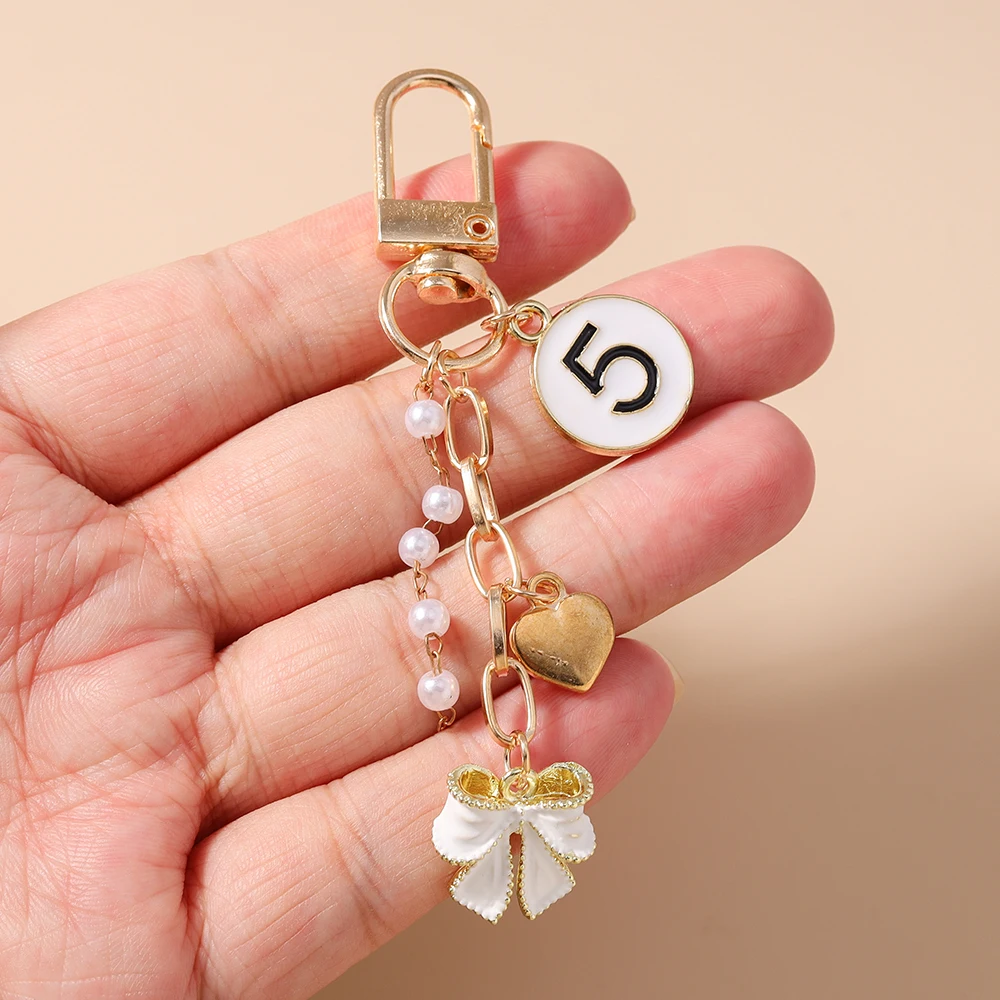 Aihua Niedlicher Y2K Metall-Schleifenherz-Schlüsselanhänger mit Perle für Damen und Mädchen, Handtaschenanhänger, DIY Handgemachter Schmuckzubehör – Detail 4