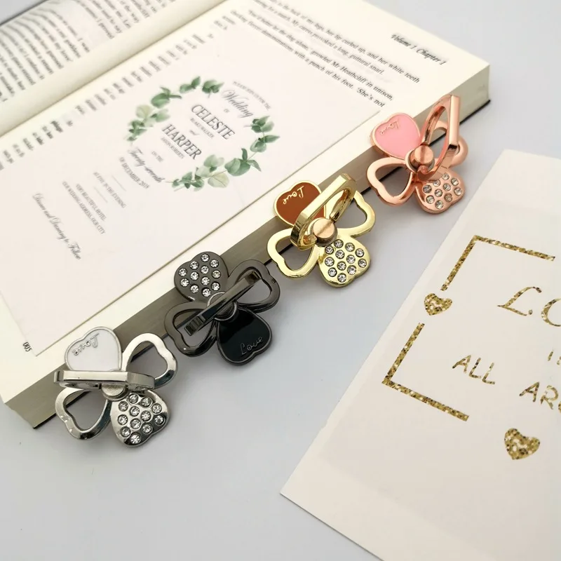 Soporte para teléfono con forma de trébol de cuatro hojas con diamantes, soporte Universal para anillo de dedo portátil y bonito, soporte de escritorio a la moda para iPhone y Xiaomi