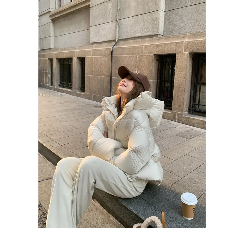 Verdikte donsjas 2025, winter nieuwe high-end mode, bladerdeegbroodpak met capuchon, losse effen damesdonsjas