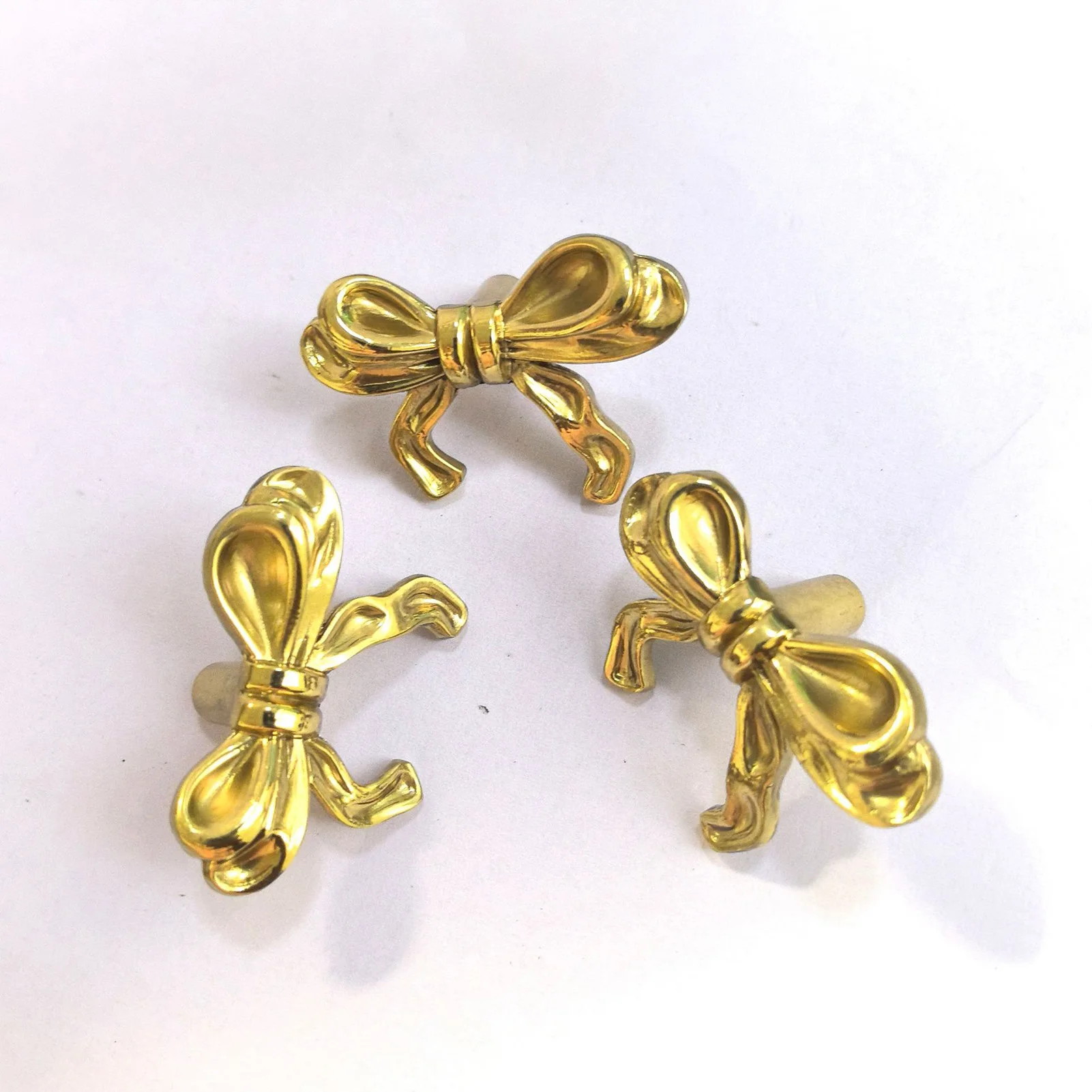 

Винтажные ручки для ящиков в форме банта, элегантные латунные золотые ручки для шкафа, кухонные шкафы и мебельные дверные ручки