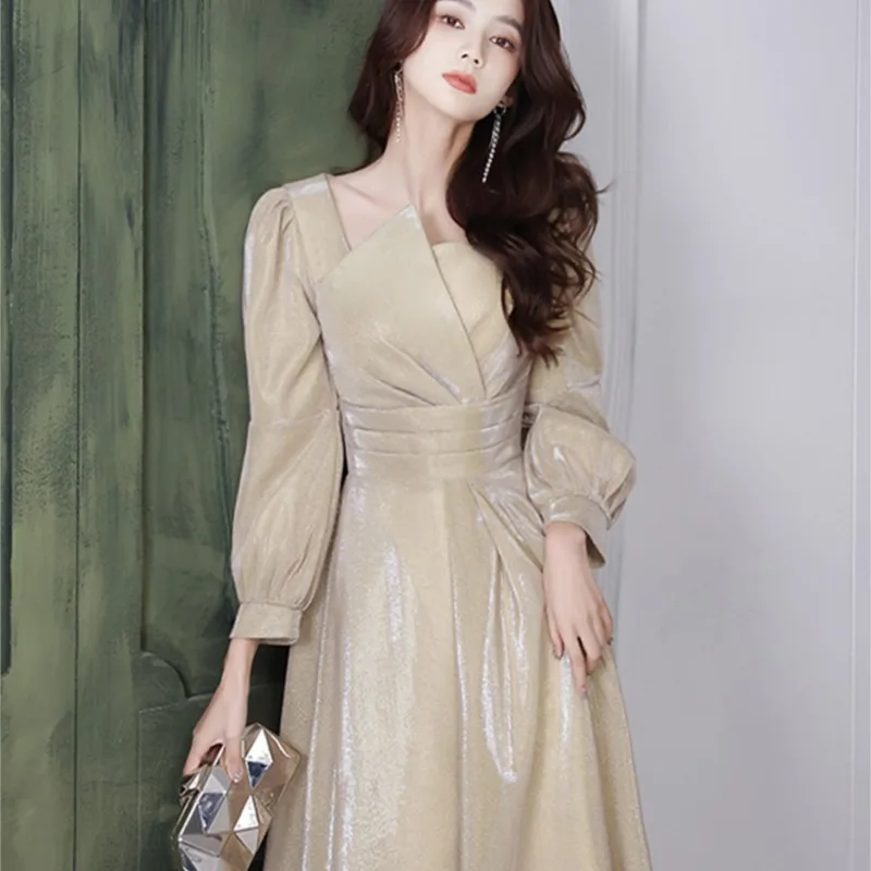 

Banquet temperament sense of light luxury minority host long-sleeved gold dress