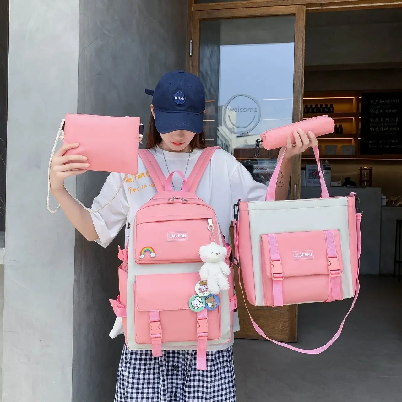 Conjunto de cuatro piezas de mochila de estudiante para mujer en versión coreana Campus de escuela secundaria de lona informal con gran capacidad