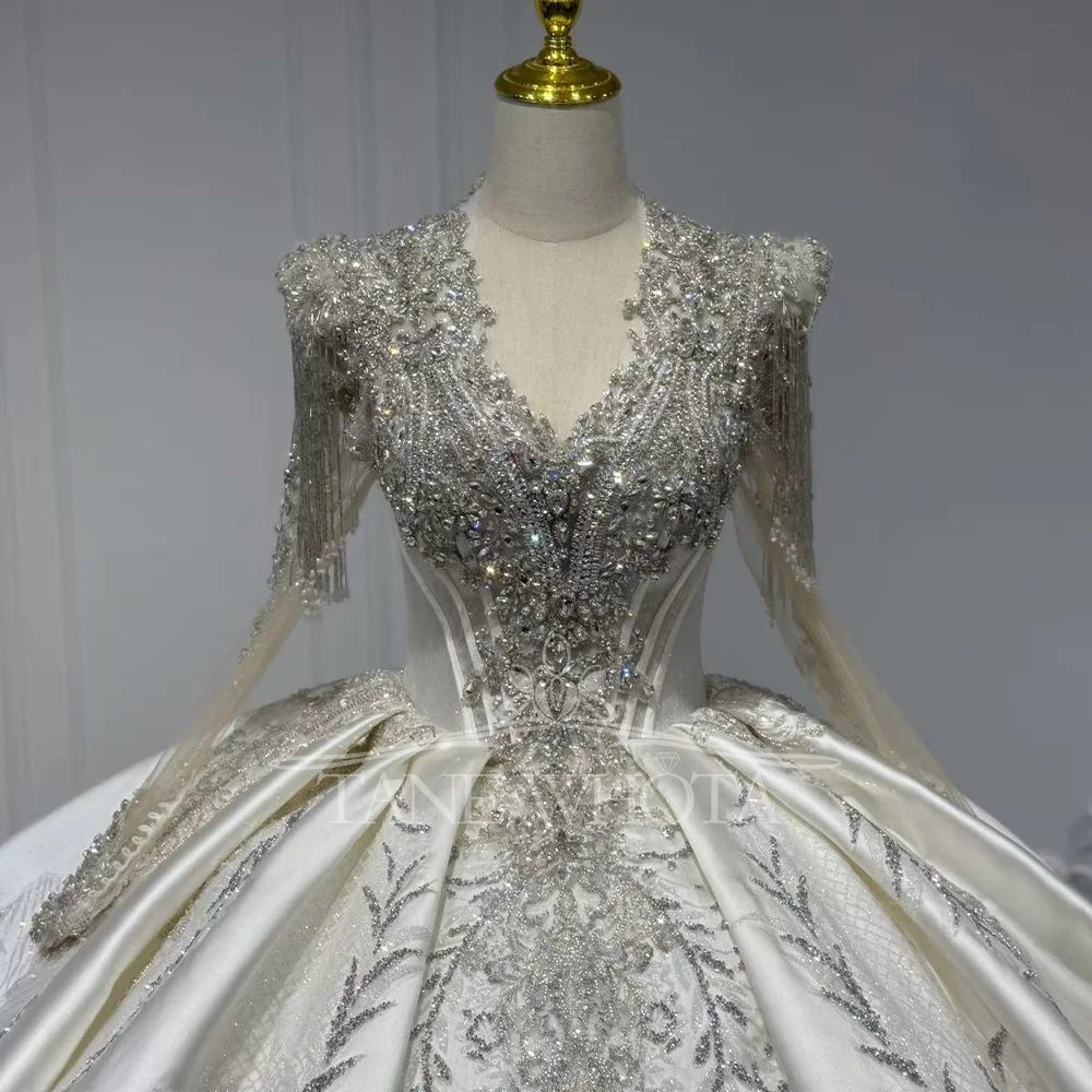 V-Neck Long Sleeve Wedding Dress With Lace-Up Keyhole Back Beaded Sequined Crystal Detail Customizable Gown