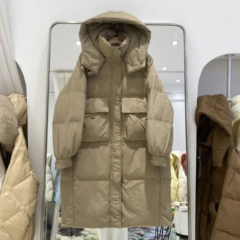 Giacca da donna media e lunga sopra il ginocchio 2025 Nuova versione coreana Moda allentata ispessita con cappuccio Piumino d'anatra bianco Marea