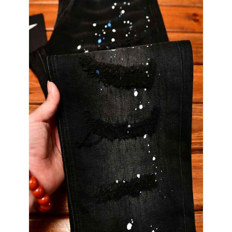 Jeans nostalgici retrò autunnali da uomo neri in difficoltà con stampa di vernice slim fit piedi piccoli pantaloni belli con volant da strada alla moda