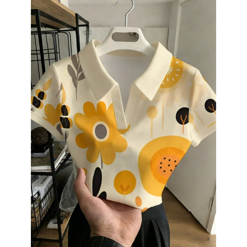 2026 Women's Fashionable Multi-functional Shirt Without Buttons, featuring flowers with yellow petals and an orange floral desig