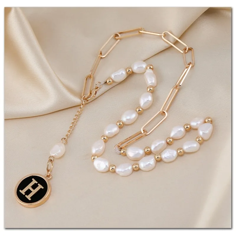 

Brand-new letter tassel titanium steel necklace, double-spliced chain, short collarbone chain