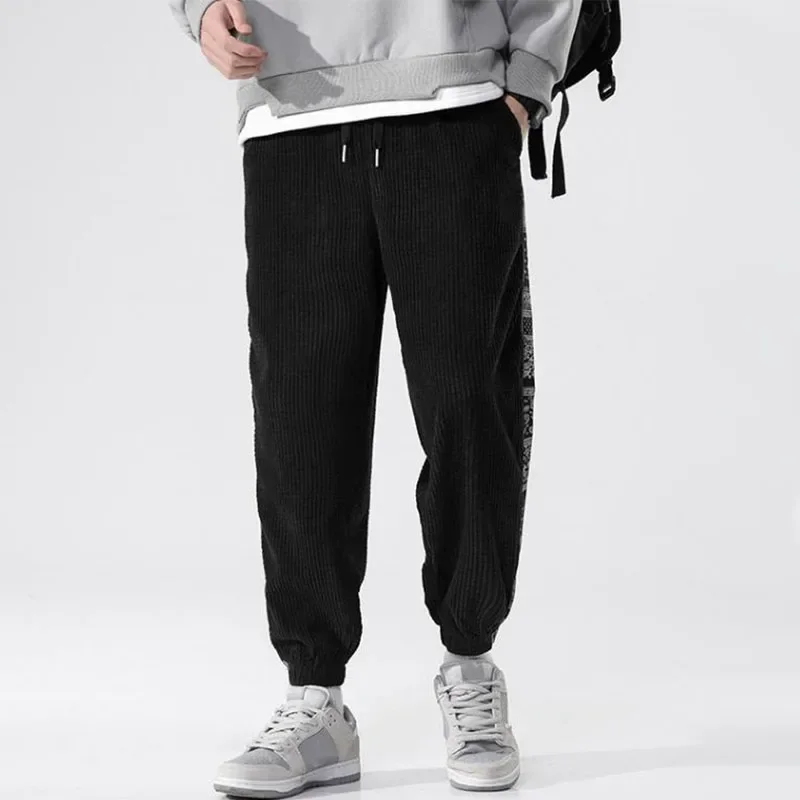 Pantalones de pana con cintura elástica para hombre, ropa de calle Harajuku, chándal informal, pantalones de retazos estampados, moda de otoño e invierno