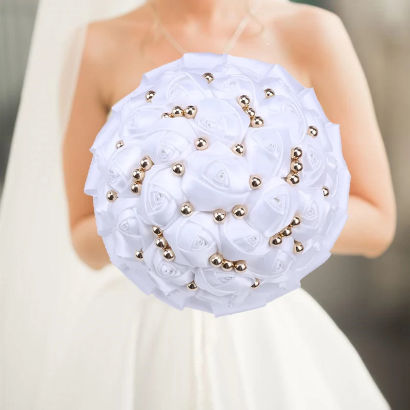 white wedding holding flowers