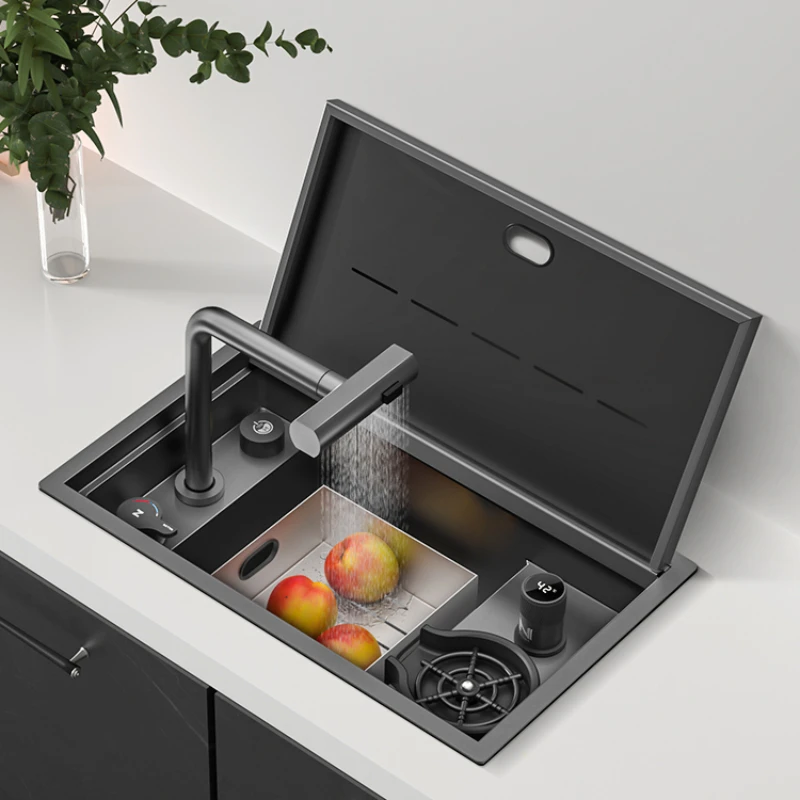 Concealed cup washer clamshell conceals the small sink on the bar counter.