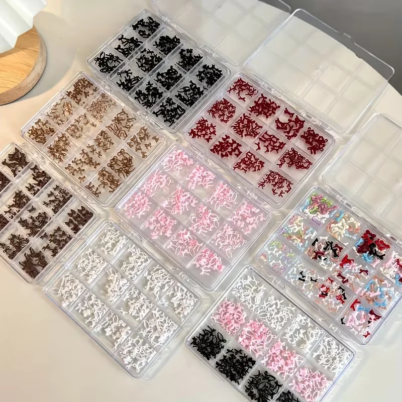 A box of 12 colorful, sweet bow nail art accessories, made of resin, perfect for DIY nail decorations.