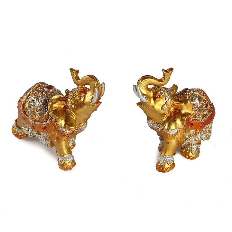 A pair of Thai retro gold elephant resin crafts ornaments office desk bedside table lucky transshipment decoration