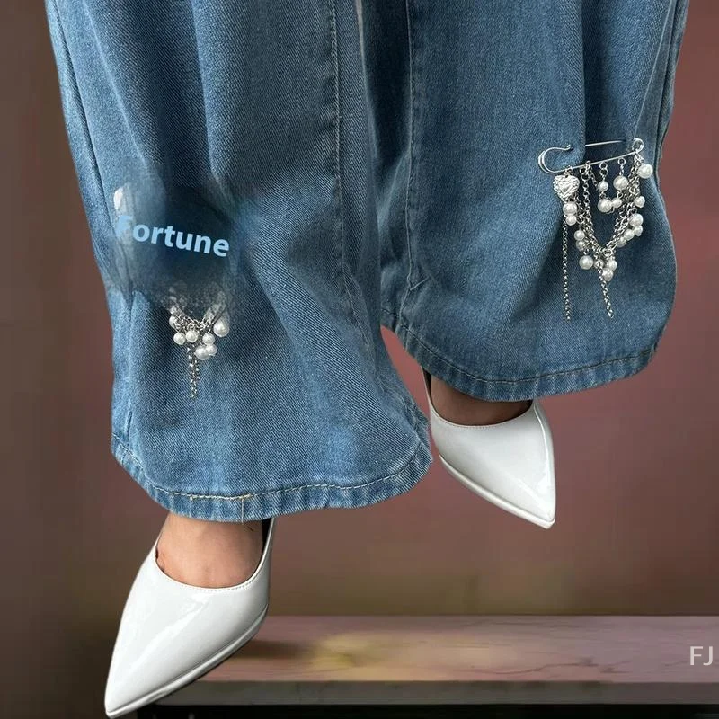 

Novelty Tassel Jean Buckle with Removable Pearl Heart Brooch Pendant, Adjustable Leg Trim and Button Clasp Detailing