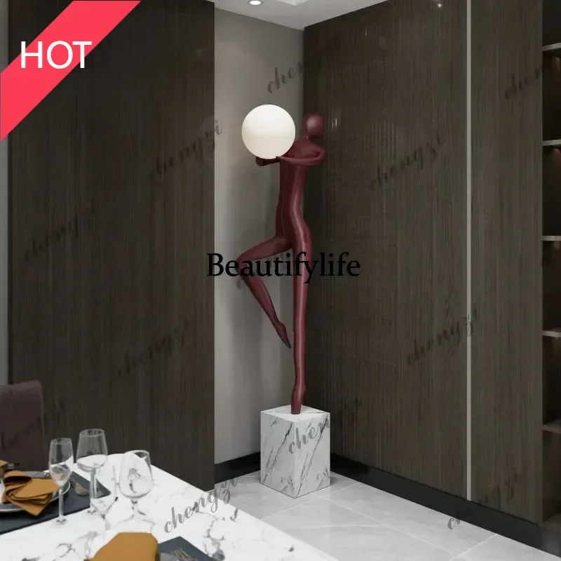 Modern welcoming abstract figure holding a lamp, sculpture ornament, creative floor lamp for living room and bedroom